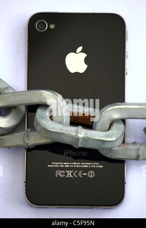 iPhone locked with a large thick chain , conceptual image Stock Photo