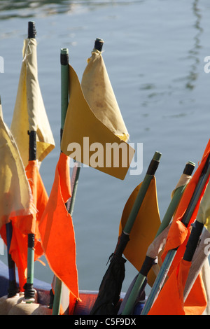 Flags on net floats on fishing boat in Italy