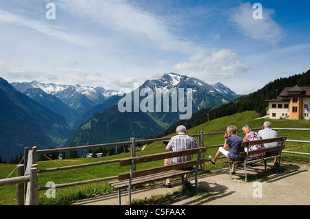 Hikers in the Austrian Alps admire the view Stock Photo