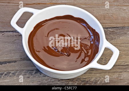 melted chocolate in a white pot Stock Photo