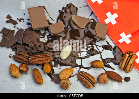 smooth chocolate pieces with chocolate sauce and nuts Stock Photo