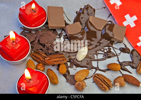 smooth chocolate pieces with chocolate sauce and nuts Stock Photo