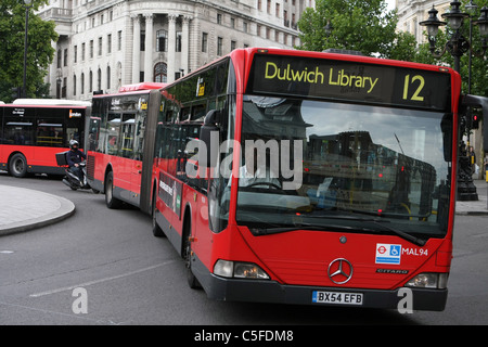 A bendy bus traveling in London Stock Photo