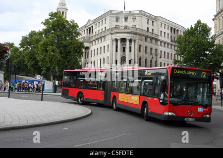 A bendy bus traveling in London Stock Photo