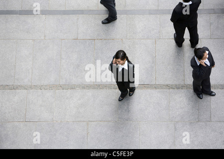 Businessmen using cellphones Stock Photo