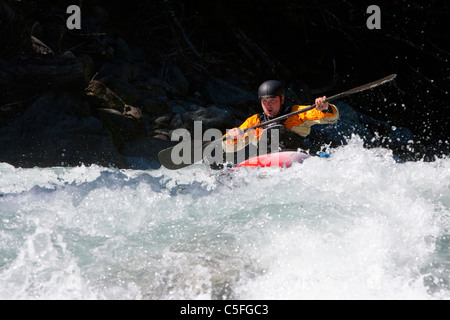 Whitewater kayaker riding rapids on Inn River near Pfunds, Austria Stock Photo