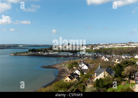 Housing and heavy industry  on Milford Haven Waterway Pembrokeshire Wales United Kingdom (UK) Stock Photo