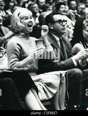 DORIS DAY with husband Marty Melcher at a basket ball game about 1964 Stock Photo