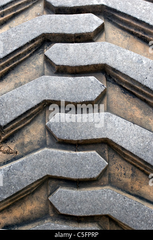 Detail up close of a tire tread from a tractor or other heavy duty construction machinery. Stock Photo