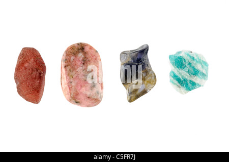 Four rock specimens all from Madagascar from left to right   Almandine, Rhodonite, Cordierite and Amazonite Stock Photo