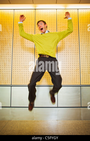 A businessman jumping in the air. Stock Photo