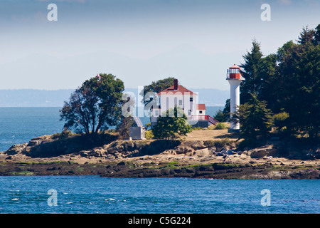 Active Pass Lighthouse on Mayne Island in the Gulf Islands between Vancouver and Victoria, British Columbia. Stock Photo