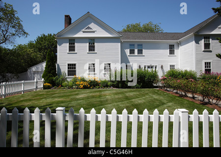 White clapboard house and white picket fence in Hyannis on Cape Cod, Massachusetts Stock Photo