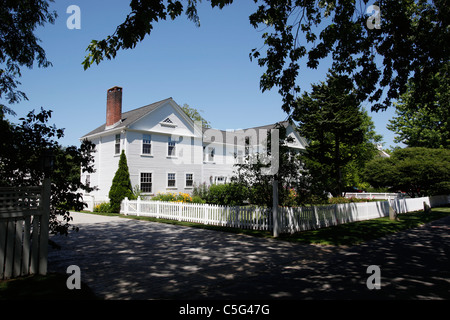 White clapboard house and white picket fence in Hyannis on Cape Cod, Massachusetts Stock Photo