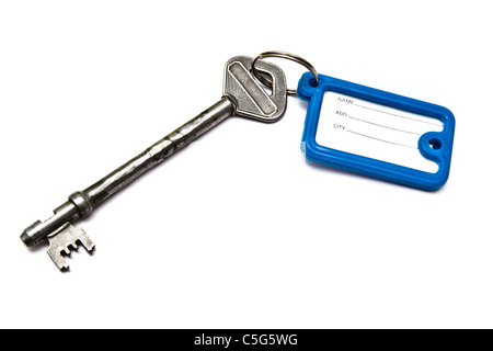 Old key with tag isolated on white background Stock Photo