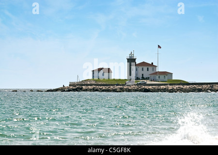 Watch Hill Rhode Islands historic lighthouse at the end of the jetty. Stock Photo