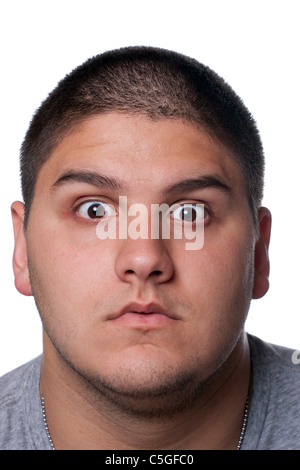 A goofy man wearing trendy nerd glasses isolated over white with a funny expression on his face. Stock Photo