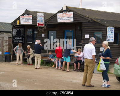 Lunch time crowd of customers at Mrs T's traditional fish and chip shop at Southwold harbour Suffolk Stock Photo