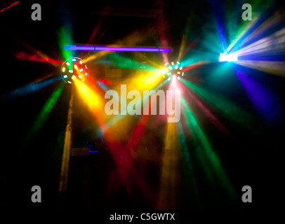 Abstract colorful disco lights in smoke Stock Photo