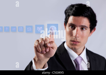 Businessman pressing on digital screen buttons on the whiteboard (selective focus) Stock Photo