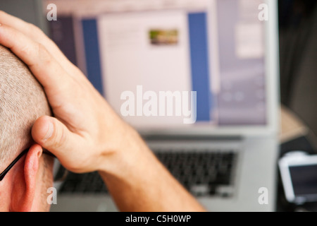 Man using laptop computer Stock Photo