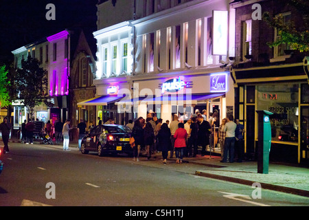 people gathered outside nightclubs and bars in Norwich, UK Stock Photo