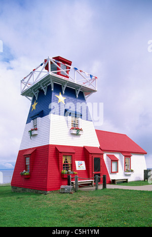 Grande Anse, New Brunswick, Canada - Replica Lighthouse / Tourist Info Centre painted in Acadian Flag Blue, White, and Red Stock Photo