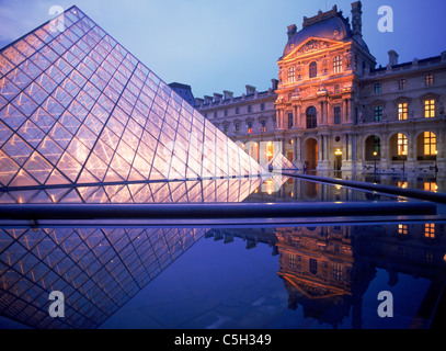 Louvre Museum and Pyramide at night in Paris France