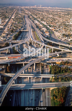 Aerial view of Los Angeles freeways like twisted cemented spaghetti amid urban sprawl and downtown Civic Center in distance Stock Photo