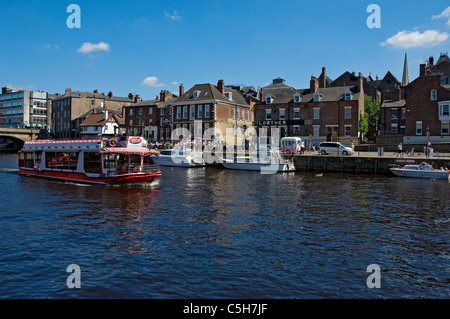 People tourists visitors on pleasure boat boats on River Ouse in summer Kings Staith York North Yorkshire England UK United Kingdom GB Great Britain Stock Photo