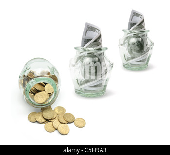 Row of Glass Jars with Money Stock Photo
