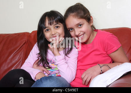A portrait of two sisters of mixed race origin. Stock Photo