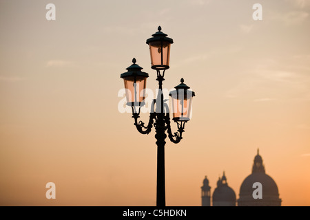An ornate street lamp at sunset, Venice, Italy Stock Photo