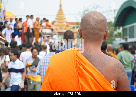 Tattooed monk attending the Wai Khru festival at Wat Bang Phra Stock Photo