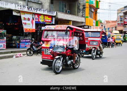 Auto rickshaws on the street of Tagbilaran city in Bohol Stock Photo