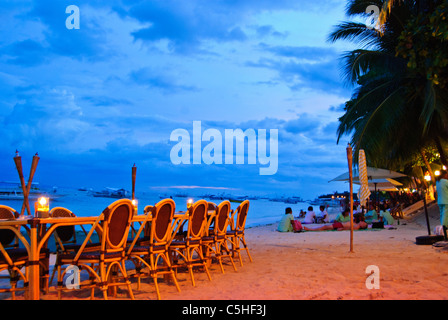 Beachfront dining table of a restaurant on Panglao Island, Bohol Stock Photo