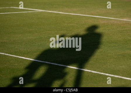 Shadow of chair umpire at  the Wimbledon Championships , Stock Photo
