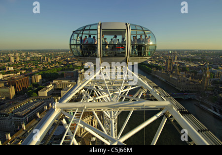 Close-up on a section of the main wheel and one of the passenger cabins on the London Eye at the top of its travel with an Stock Photo