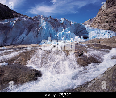 A vigourous melt-water stream issuing from the snout of the Nigardsbreen glacier, Jostedal National Park, Norway Stock Photo