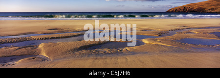 Deserted sandy beach with green breakers at Clashnessie, west Sutherland, Scottish Highlands, UK. Stock Photo