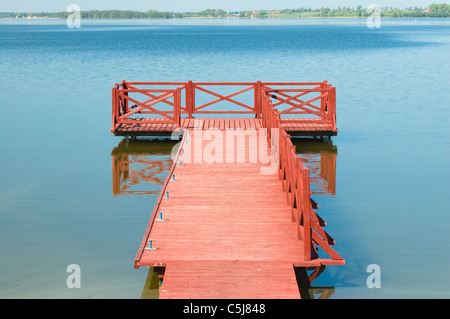 Footbridge on the lake in Masuria district, Poland Stock Photo