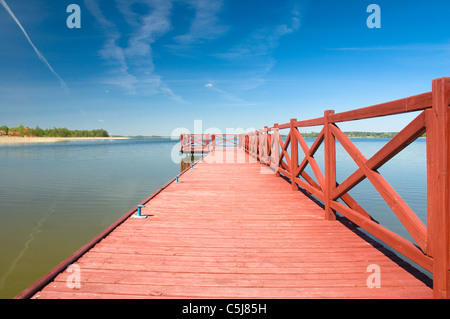 Footbridge on the lake in Masuria district, Poland Stock Photo