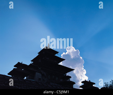 Temple pagodas in Durbar Square outlined against clouds and blue sky in Kathmandu, Nepal Stock Photo