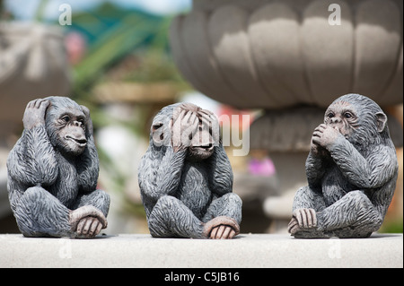 Three wise Monkeys . Stone garden ornaments Stock Photo