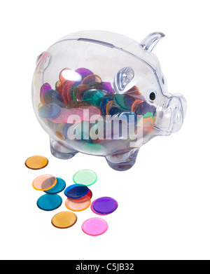 Clear piggy bank full of colorful chips instead of money - path included Stock Photo