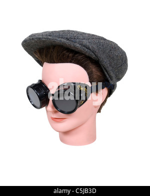 Ready for a leisurely drive wearing black steam punk goggles and a tweed driving cap Stock Photo