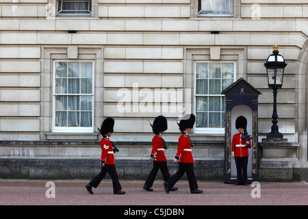 Scots Guards of Royal Queen's Guard during Changing of the Guard ceremony outside Buckingham Palace, London, England Stock Photo