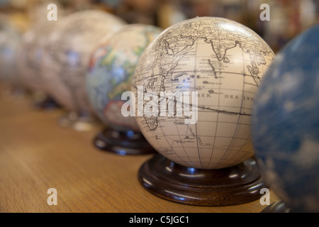 Several antique and old style globe maps with shallow depth of field Stock Photo