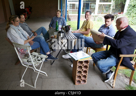 Group of Artists talking at the table Stock Photo