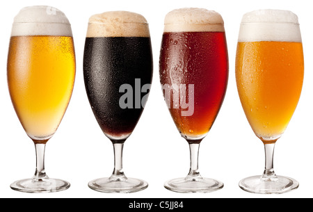 Four glasses with different beers on a white background. The file contains a path to cut. Stock Photo